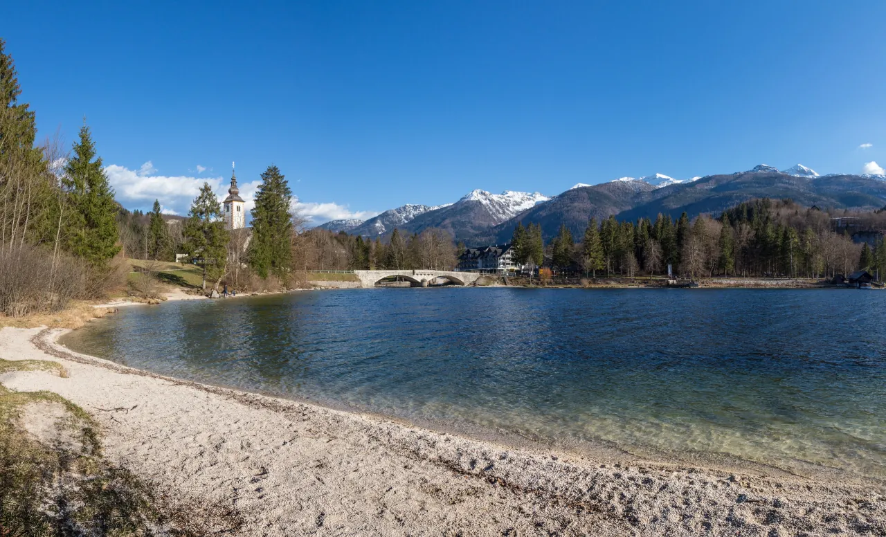 Lake Bohinj at Ribčev Laz, with St John the Baptist Church and the Julian Alps